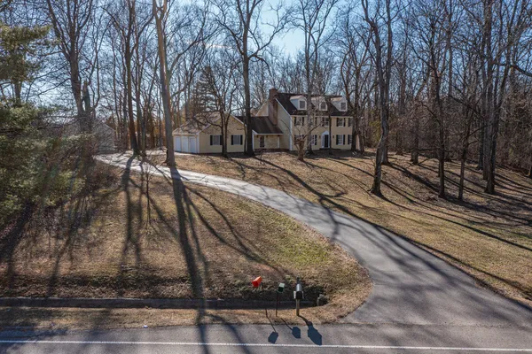 a view of a house with backyard