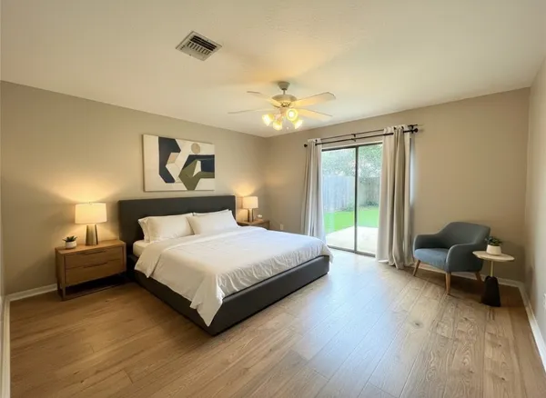 a bedroom with a bed and a chair