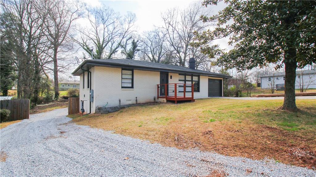 5207 White Boulevard Southwest Mableton, GA 30126 - Photo 2 of 30 a view of a house with a yard and garage