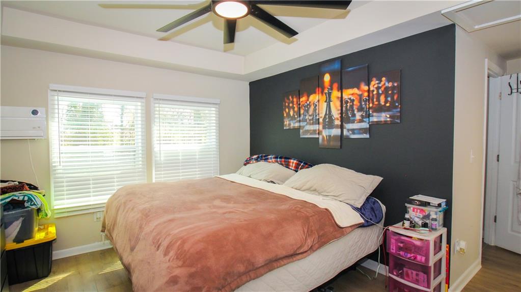 5207 White Boulevard Southwest Mableton, GA 30126 - Photo 23 of 30 a bed sitting in a bedroom next to a window