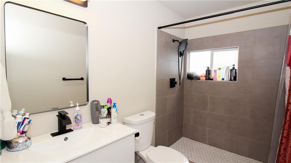 5207 White Boulevard Southwest Mableton, GA 30126 - Photo 25 of 30 a bathroom with a sink toilet and shower