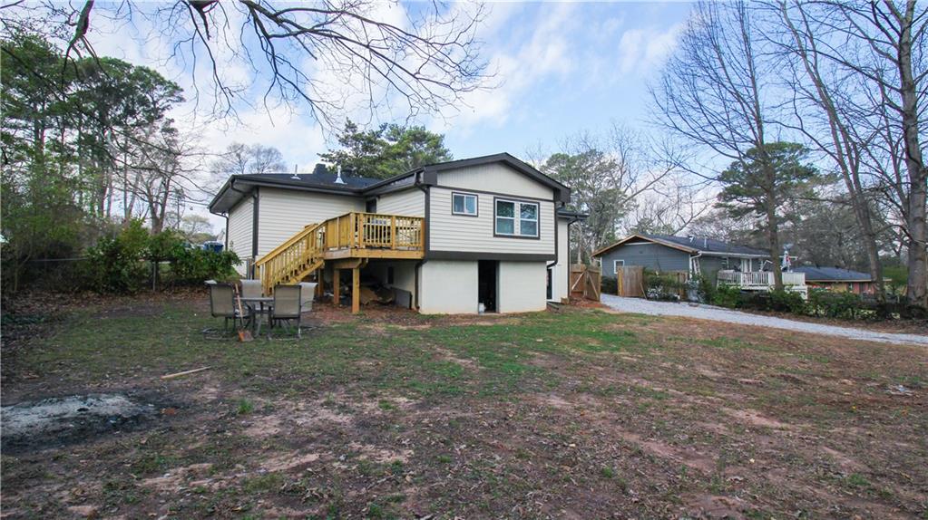 5207 White Boulevard Southwest Mableton, GA 30126 - Photo 27 of 30 a front view of a house with a yard and garage