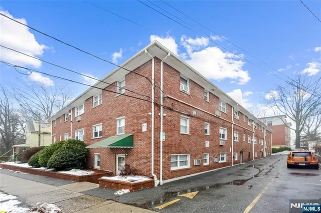 a view of a building with a street