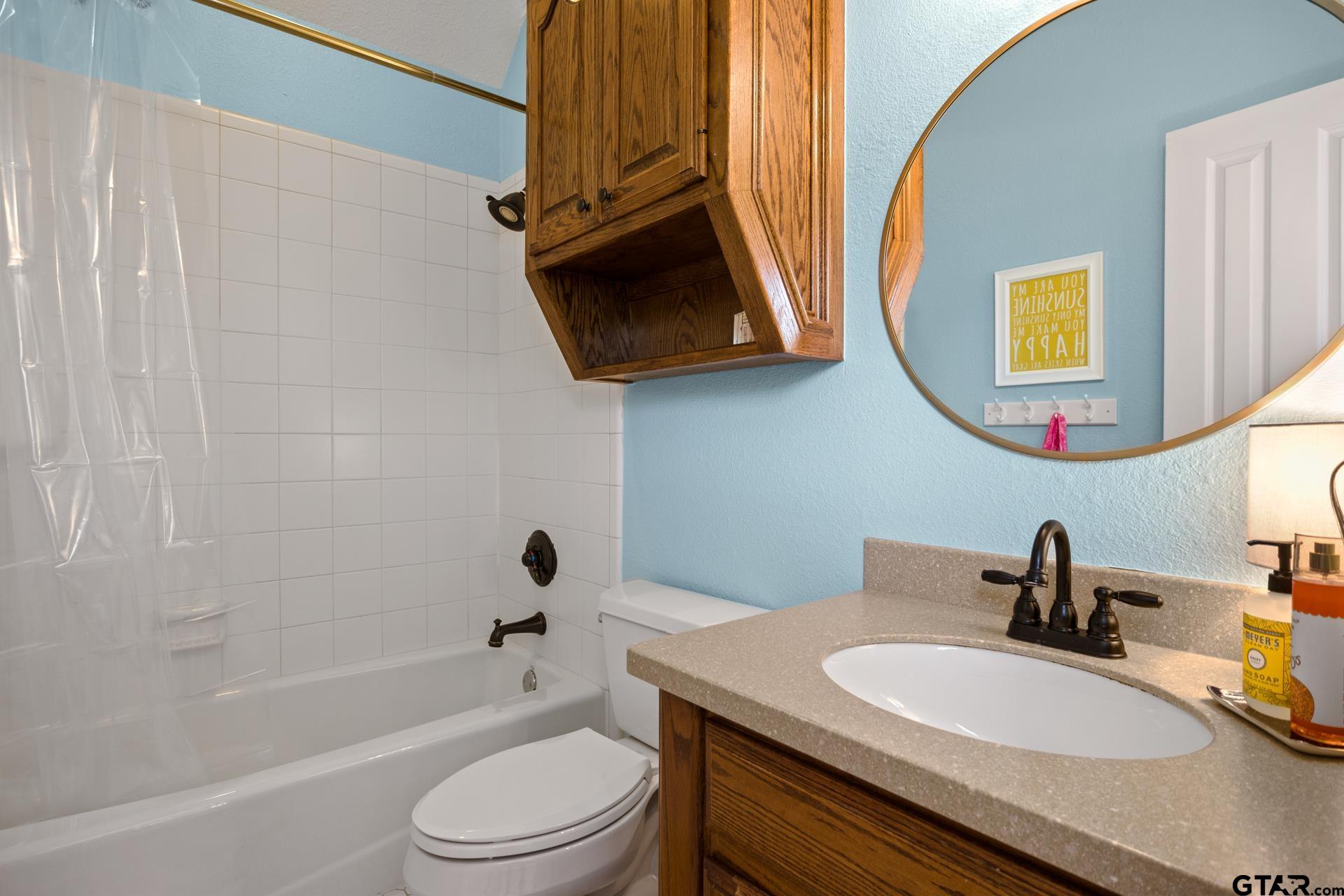134 Private Road New Boston, TX 75570 - Photo 25 of 40 a bathroom with a granite countertop sink and a mirror