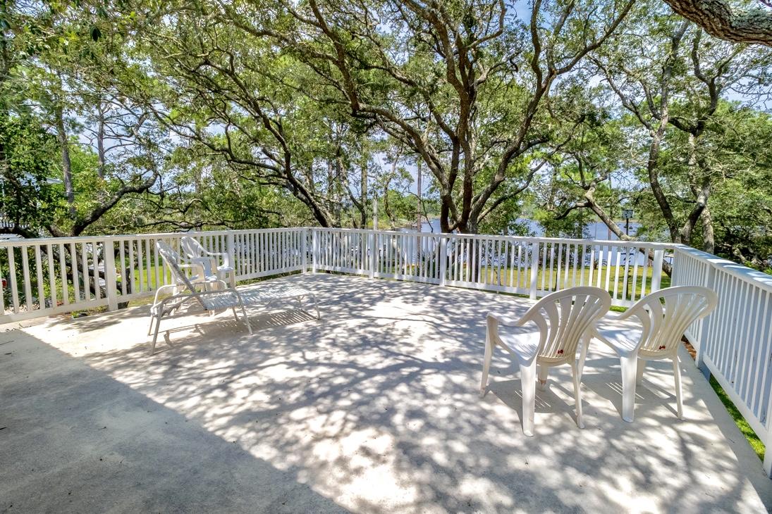 79 Garfield Street Santa Rosa Beach, FL 32459 - Photo 33 of 49 a view of backyard with a table and chairs