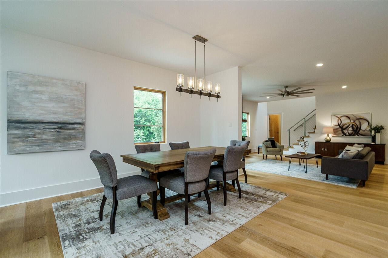 1619 Lorraine Road Raleigh, NC 27607 - Photo 5 of 30 The entire Main Floor is flooded with light from Coastal-Rated Custom Marvin Windows, but is at once cozy and private. The Open Plan space is an Entertainer's dream. Dining Room