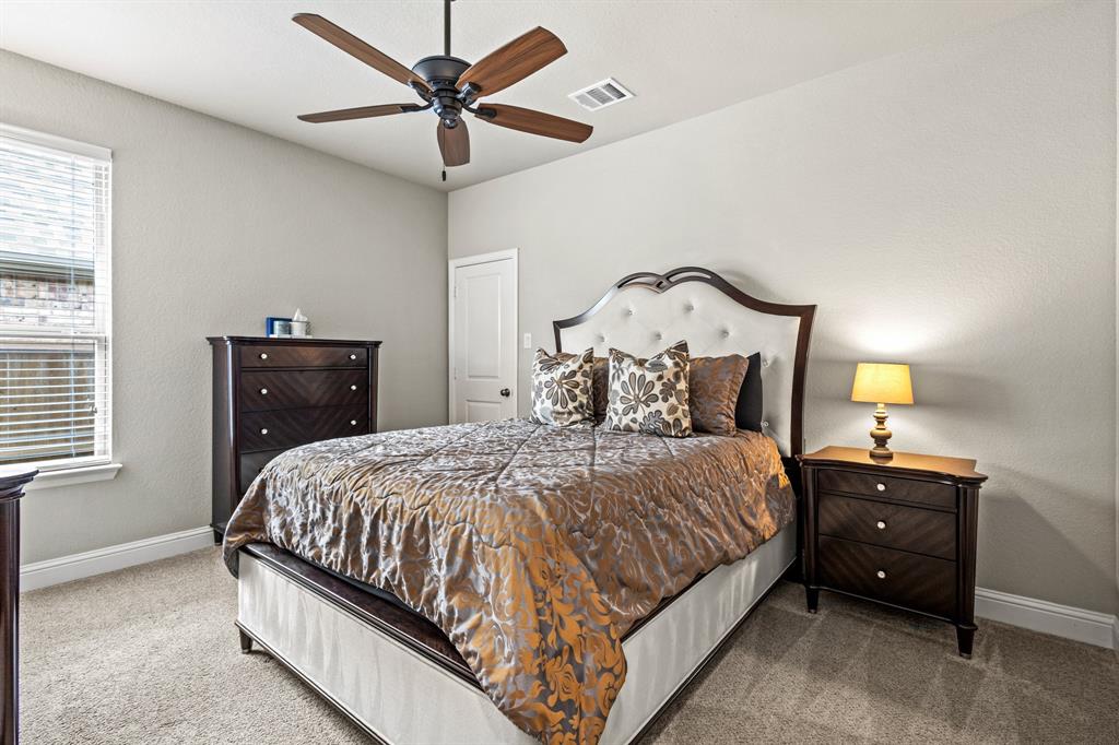 3406 Woodford Drive Mansfield, TX 76084 - Photo 13 of 29 a bedroom with a bed and window