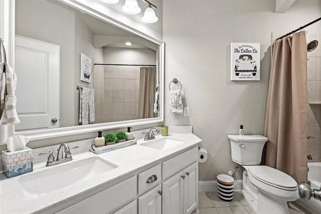 a bathroom with a bathtub and sink