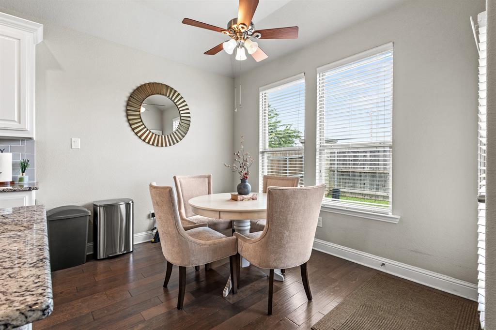 3406 Woodford Drive Mansfield, TX 76084 - Photo 17 of 29 a dining room with furniture a window and wooden floor