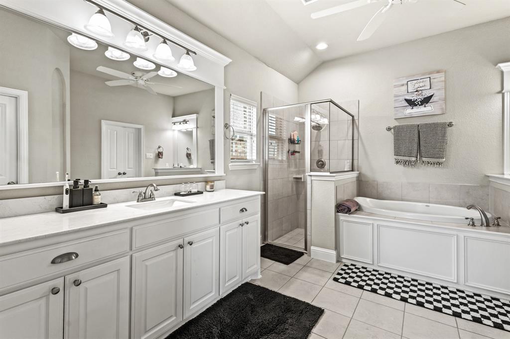 3406 Woodford Drive Mansfield, TX 76084 - Photo 20 of 29 a bathroom with a sink a toilet and shower