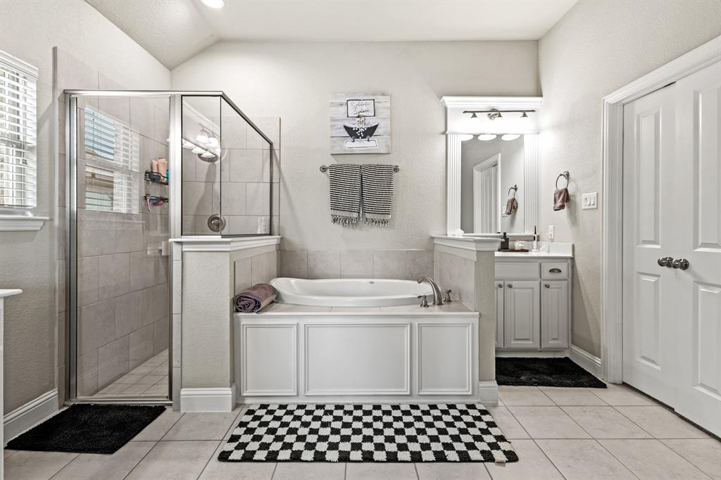 3406 Woodford Drive Mansfield, TX 76084 - Photo 21 of 29 a bathroom with a sink a toilet a shower and a mirror