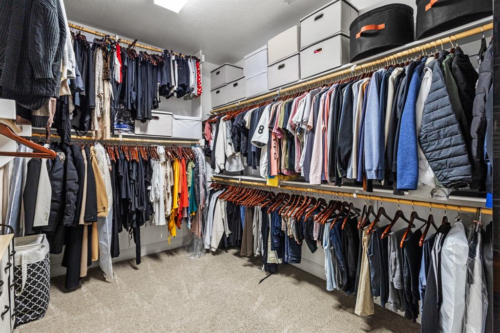 3406 Woodford Drive Mansfield, TX 76084 - Photo 23 of 29 a view of walk in closet with clothes and shoes