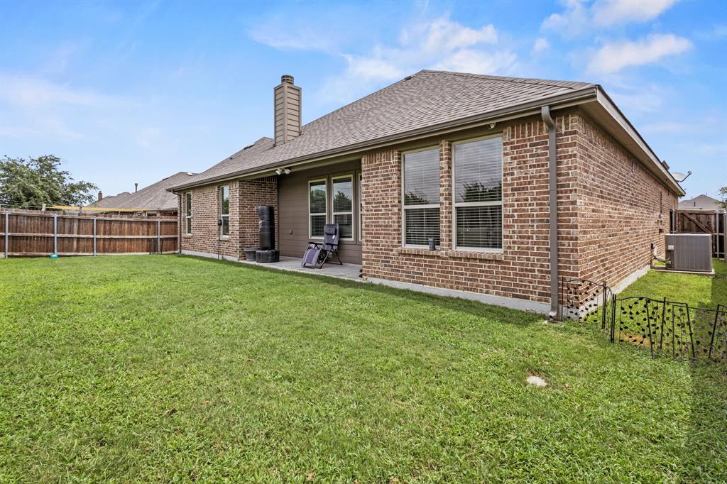 3406 Woodford Drive Mansfield, TX 76084 - Photo 25 of 29 a front view of a house with garden