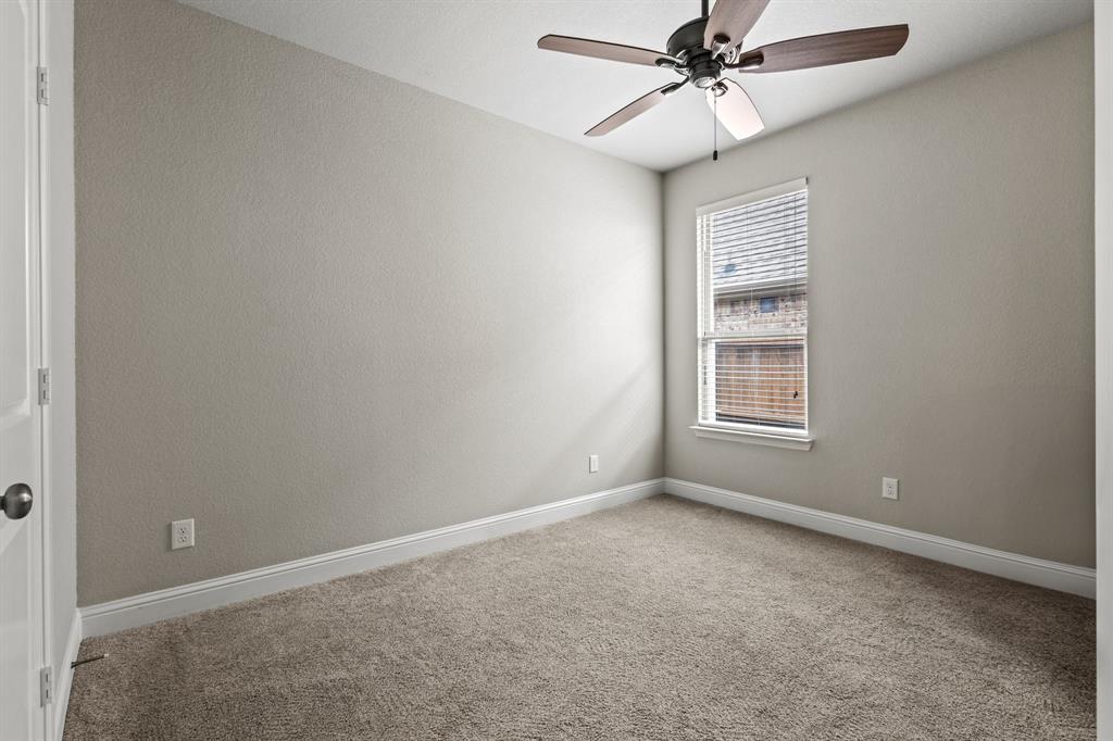 3406 Woodford Drive Mansfield, TX 76084 - Photo 27 of 29 an empty room with windows and fan