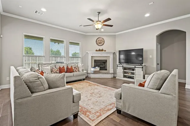 a living room with furniture and a fireplace