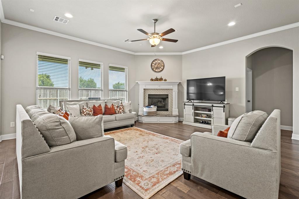 3406 Woodford Drive Mansfield, TX 76084 - Photo 4 of 29 a living room with furniture and a flat screen tv