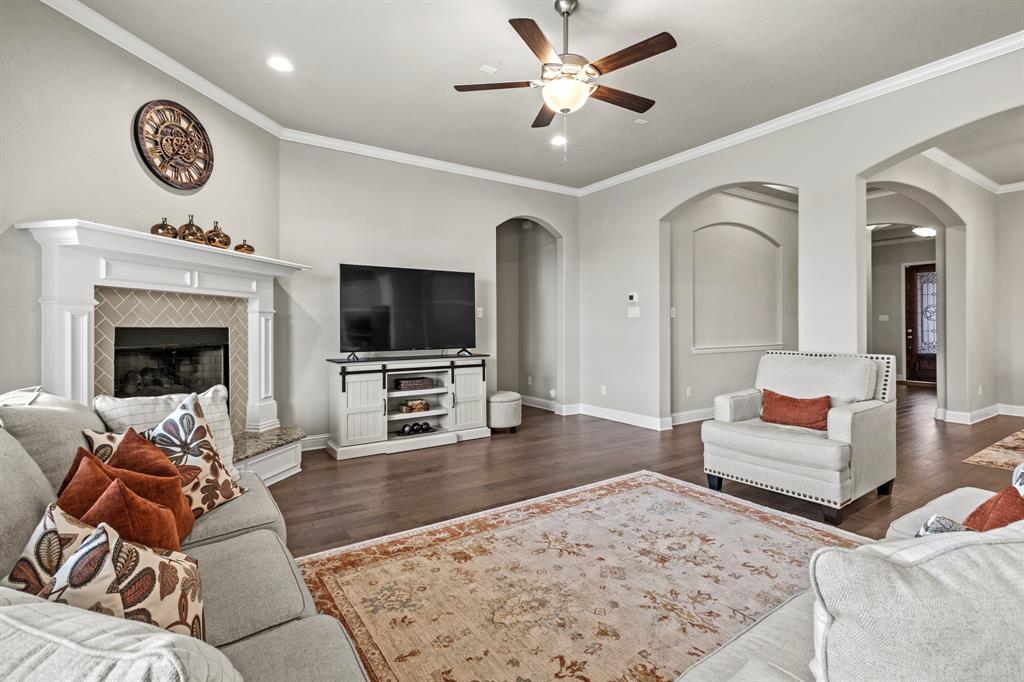 3406 Woodford Drive Mansfield, TX 76084 - Photo 6 of 29 a living room with furniture and a flat screen tv
