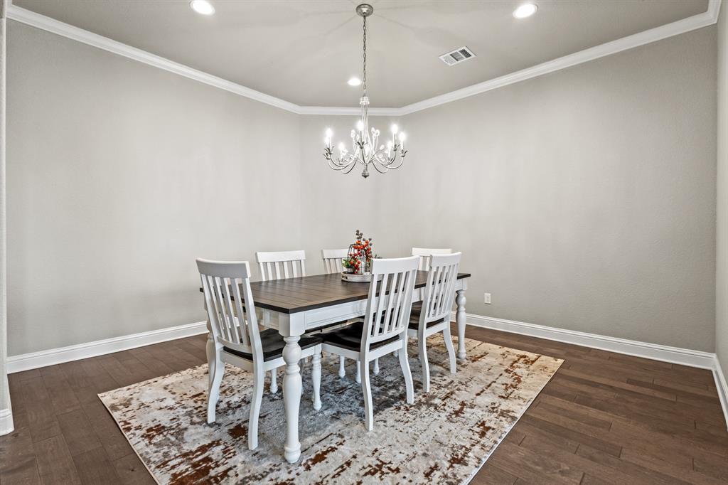 3406 Woodford Drive Mansfield, TX 76084 - Photo 8 of 29 a view of a dining room with furniture and chandelier