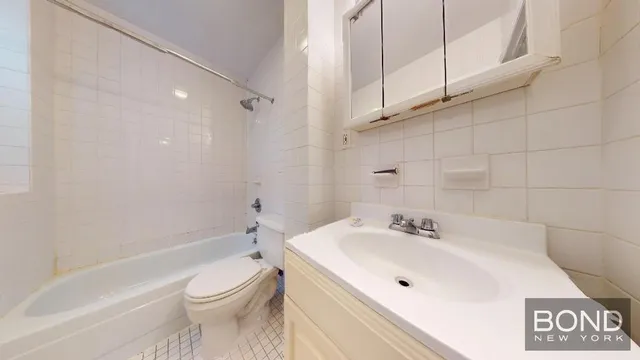 a bathroom with a toilet sink and bathtub