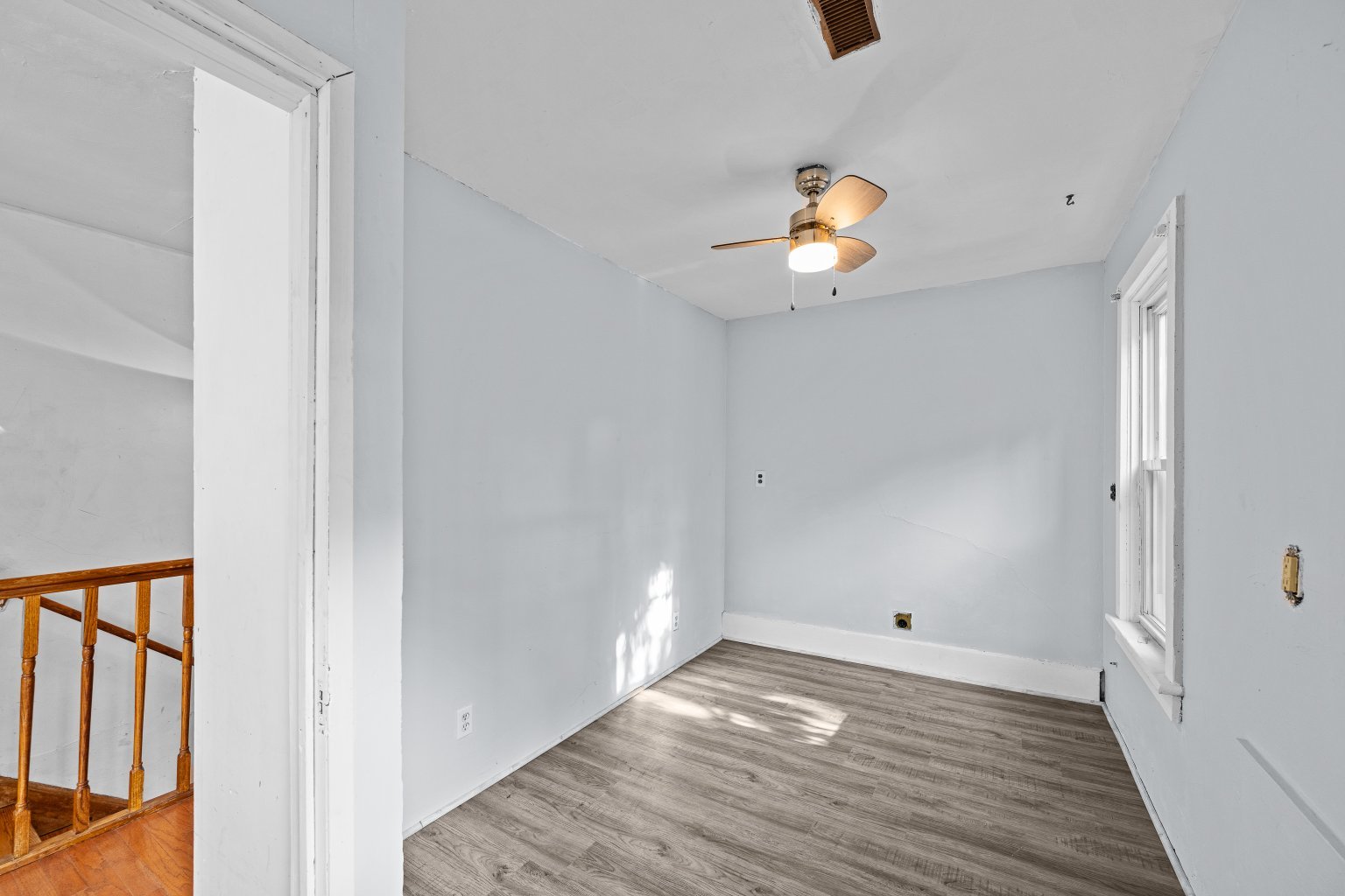 200 West Locust Street Cambridge, IL 61238 - Photo 22 of 32 a view of an empty room with wooden floor and windows