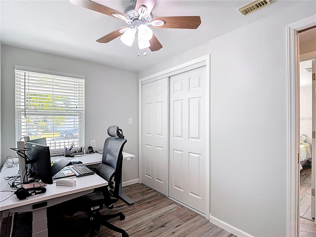 13607 Frances Avenue Hudson, FL 34667 - Photo 28 of 76 a view of a workspace with furniture and a window