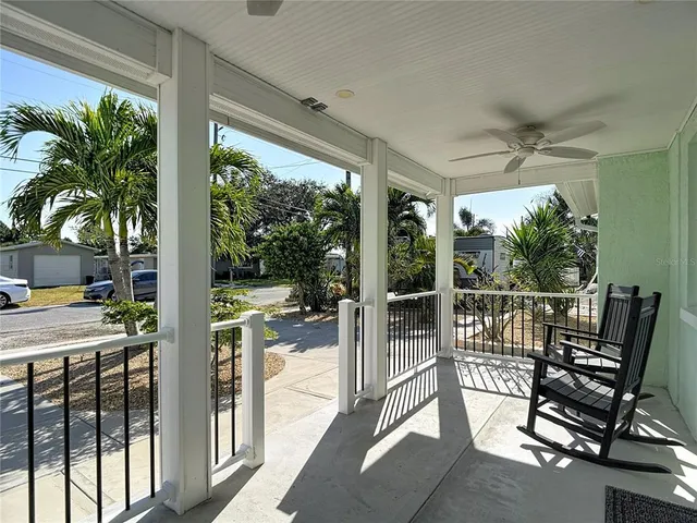 a view of a patio with a table chairs and balcony