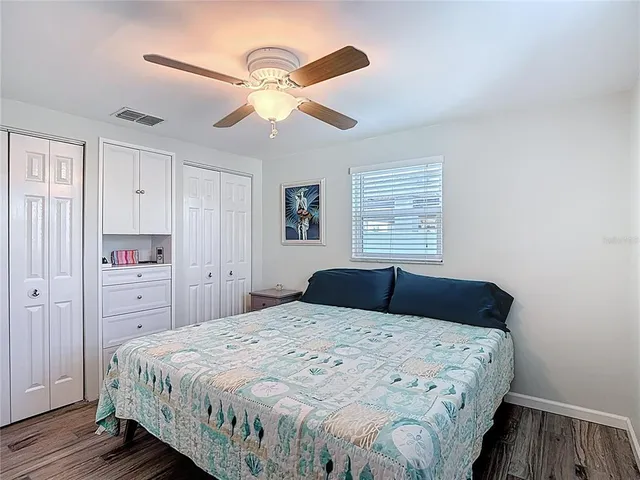 a yellow house with trees in front of it