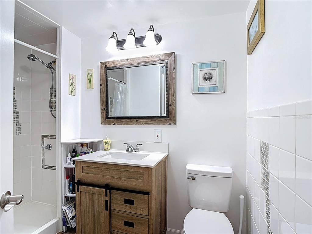13607 Frances Avenue Hudson, FL 34667 - Photo 40 of 76 a bathroom with a toilet sink and mirror