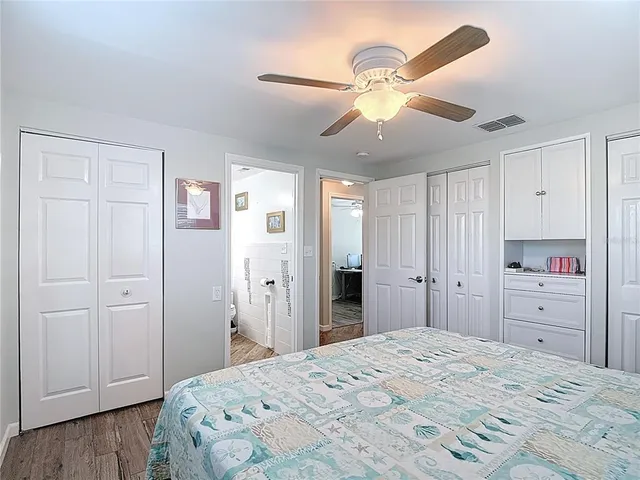 a view of a house with backyard and trees