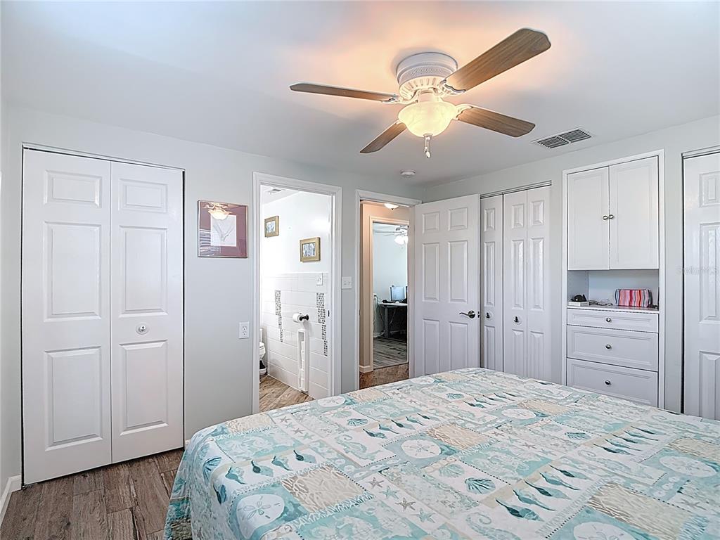 13607 Frances Avenue Hudson, FL 34667 - Photo 42 of 76 a bedroom with a bed and cabinets