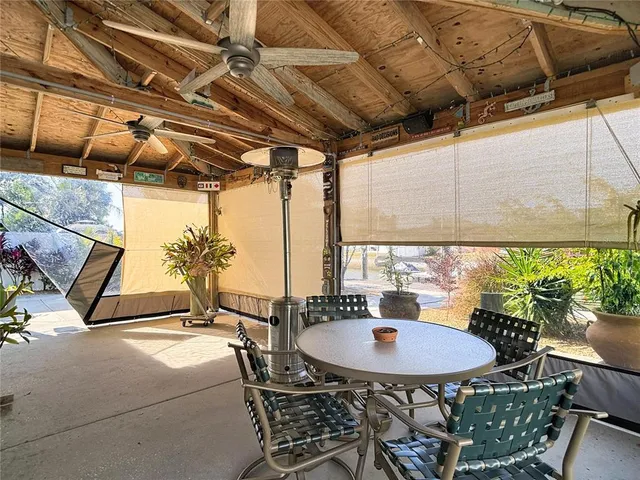 a view of a house with a snow yard and palm trees