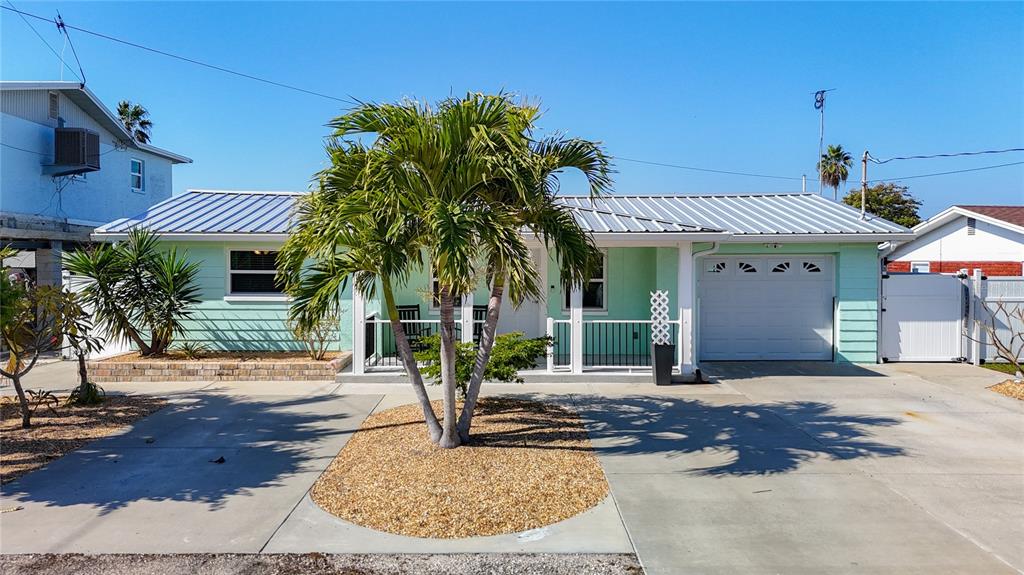 13607 Frances Avenue Hudson, FL 34667 - Photo 69 of 76 a front view of a house with garden