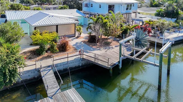 an empty room with wooden floor and window