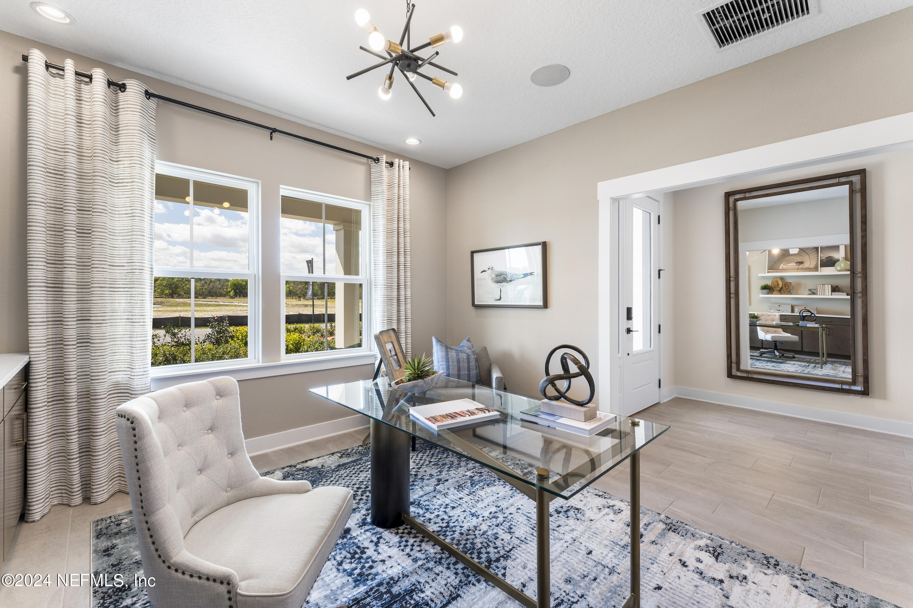 34 Natureland Circle St. Augustine, FL 32092 - Photo 7 of 26 a living room with furniture a rug and a window