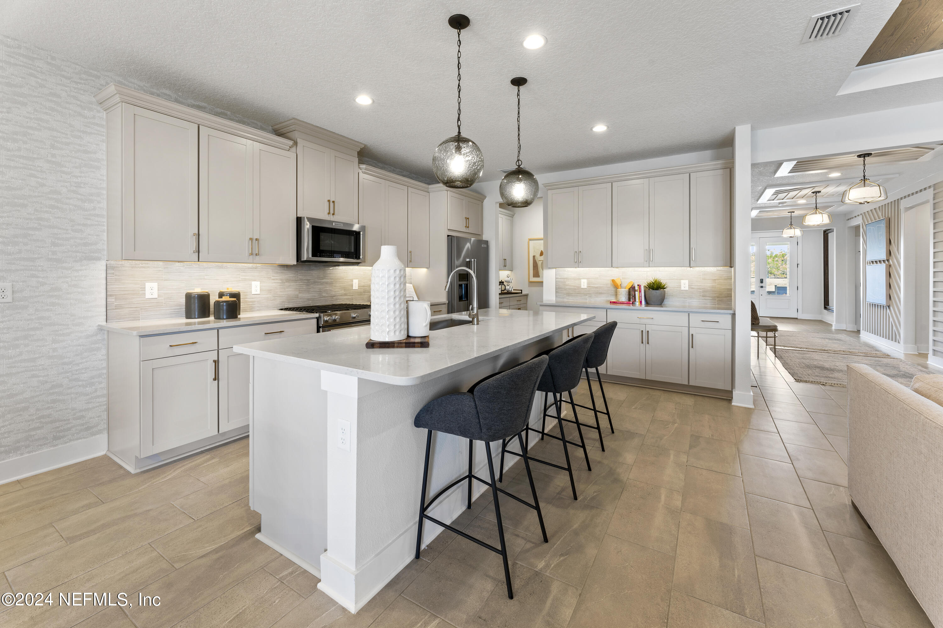 34 Natureland Circle St. Augustine, FL 32092 - Photo 10 of 26 a kitchen with counter space appliances and a view of living room