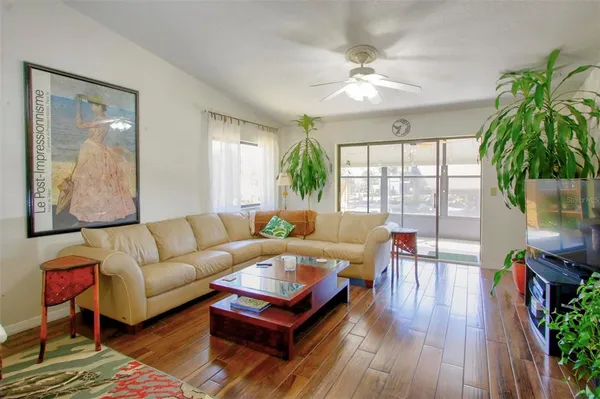 a living room with furniture and a large window
