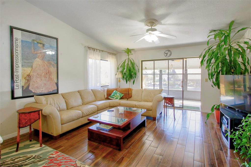 6502 River Run Boulevard, Unit 6502 Weeki Wachee, FL 34607 - Photo 19 of 47 a living room with furniture and a large window