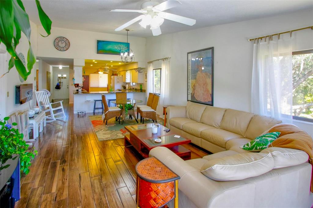 6502 River Run Boulevard, Unit 6502 Weeki Wachee, FL 34607 - Photo 20 of 47 a living room with furniture and a large window