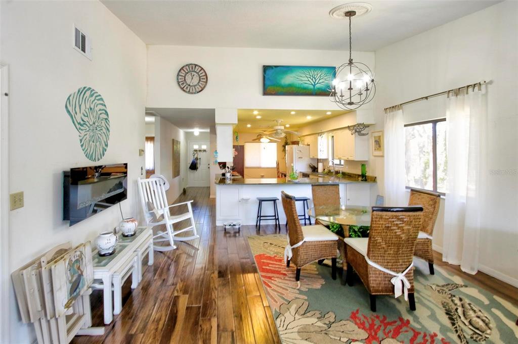 6502 River Run Boulevard, Unit 6502 Weeki Wachee, FL 34607 - Photo 21 of 47 a living room with furniture and a flat screen tv