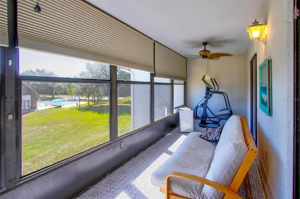 a view of swimming pool with furniture and garden