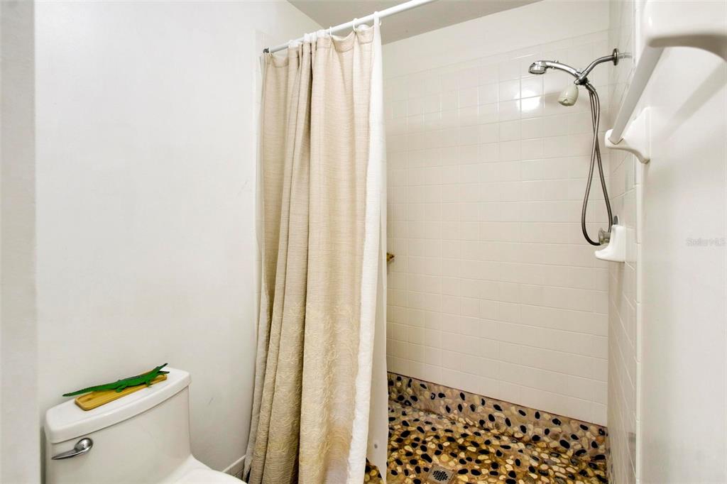 6502 River Run Boulevard, Unit 6502 Weeki Wachee, FL 34607 - Photo 30 of 47 a bathroom with a shower and a toilet