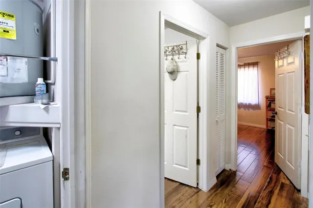a view of hallway with wooden floor