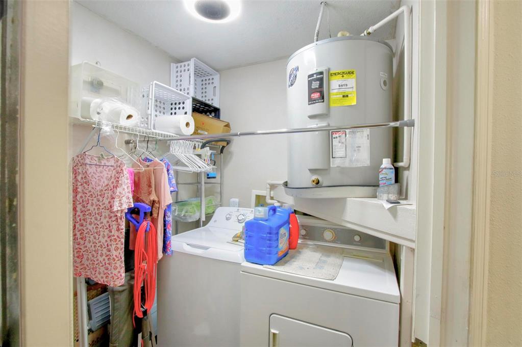 6502 River Run Boulevard, Unit 6502 Weeki Wachee, FL 34607 - Photo 32 of 47 a utility room with dryer and washer