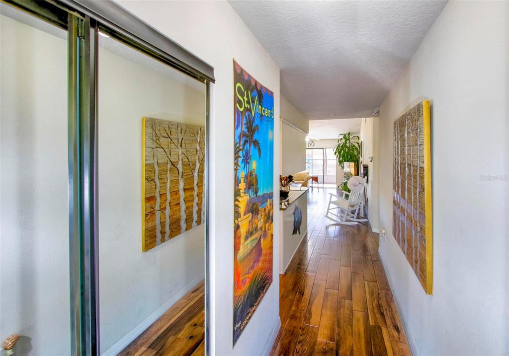 6502 River Run Boulevard, Unit 6502 Weeki Wachee, FL 34607 - Photo 5 of 47 a view of a hallway with wooden floor and a furniture