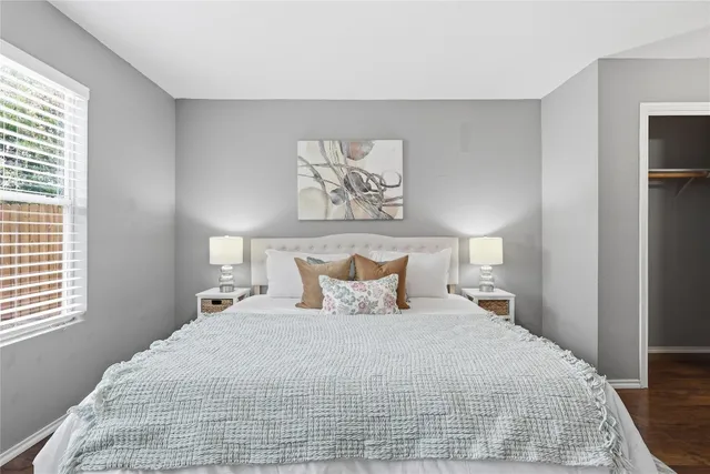 a bedroom with a bed and window