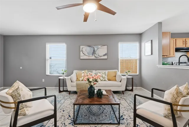 a living room with furniture and a large window