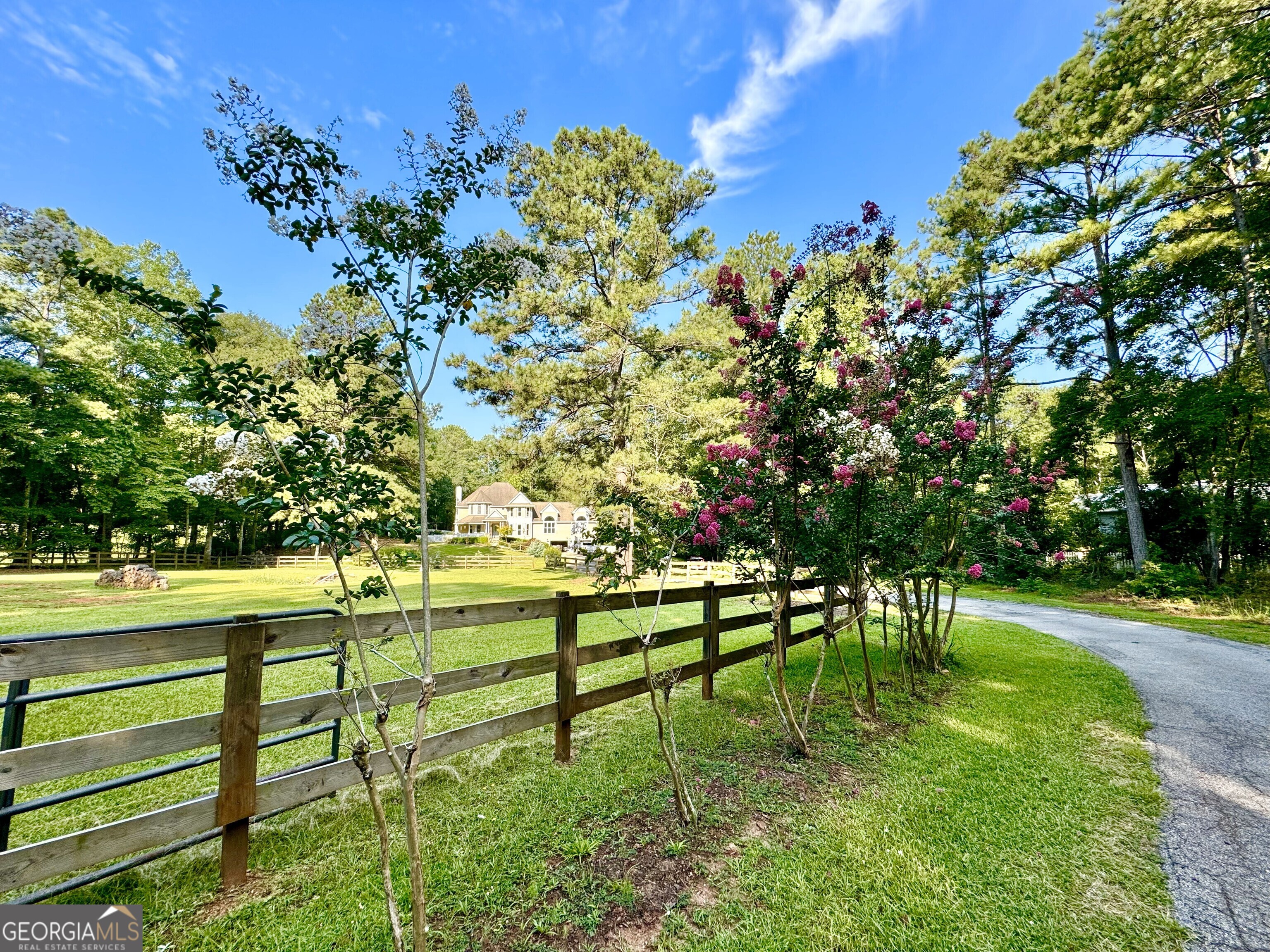 48 Tanglewood Road Newnan, GA 30263 - Photo 1 of 1 a view of backyard with wooden fence