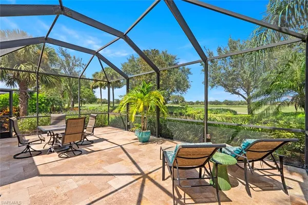 a view of an outdoor sitting area with furniture
