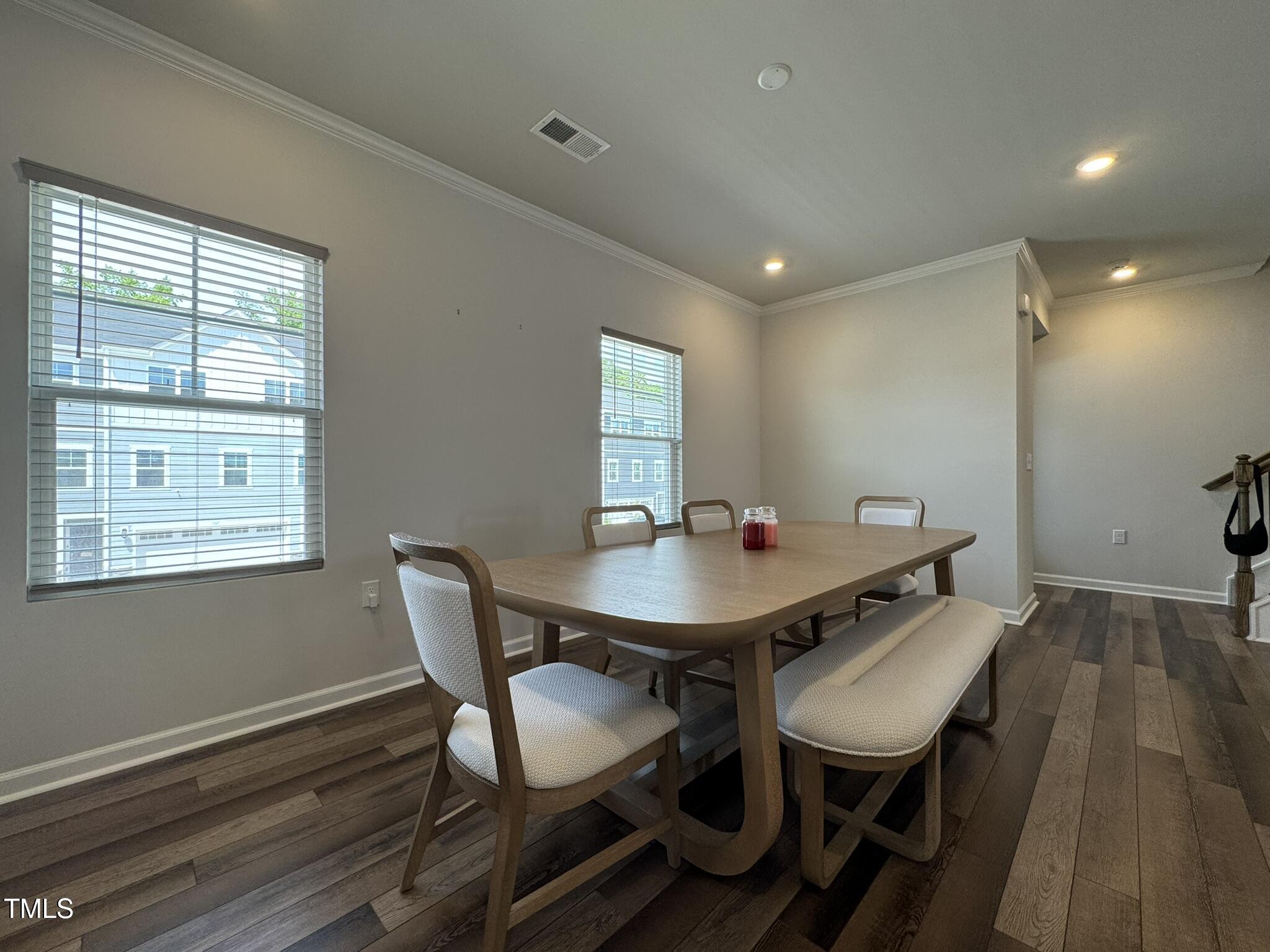 1106 Crossvine Trail Durham, NC 27703 - Photo 12 of 35 a view of a dining room with furniture and wooden floor