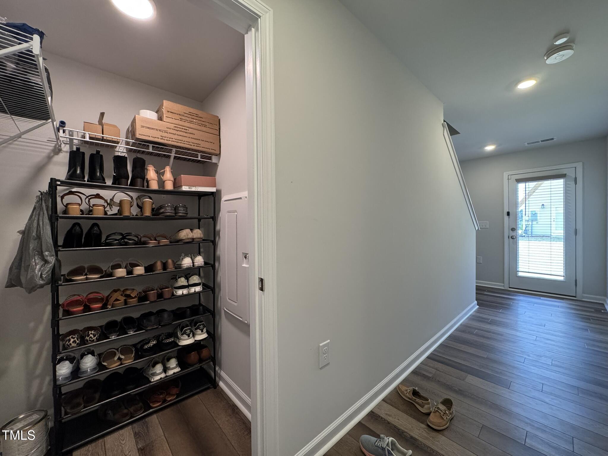 1106 Crossvine Trail Durham, NC 27703 - Photo 23 of 35 walk in closet with wooden floor